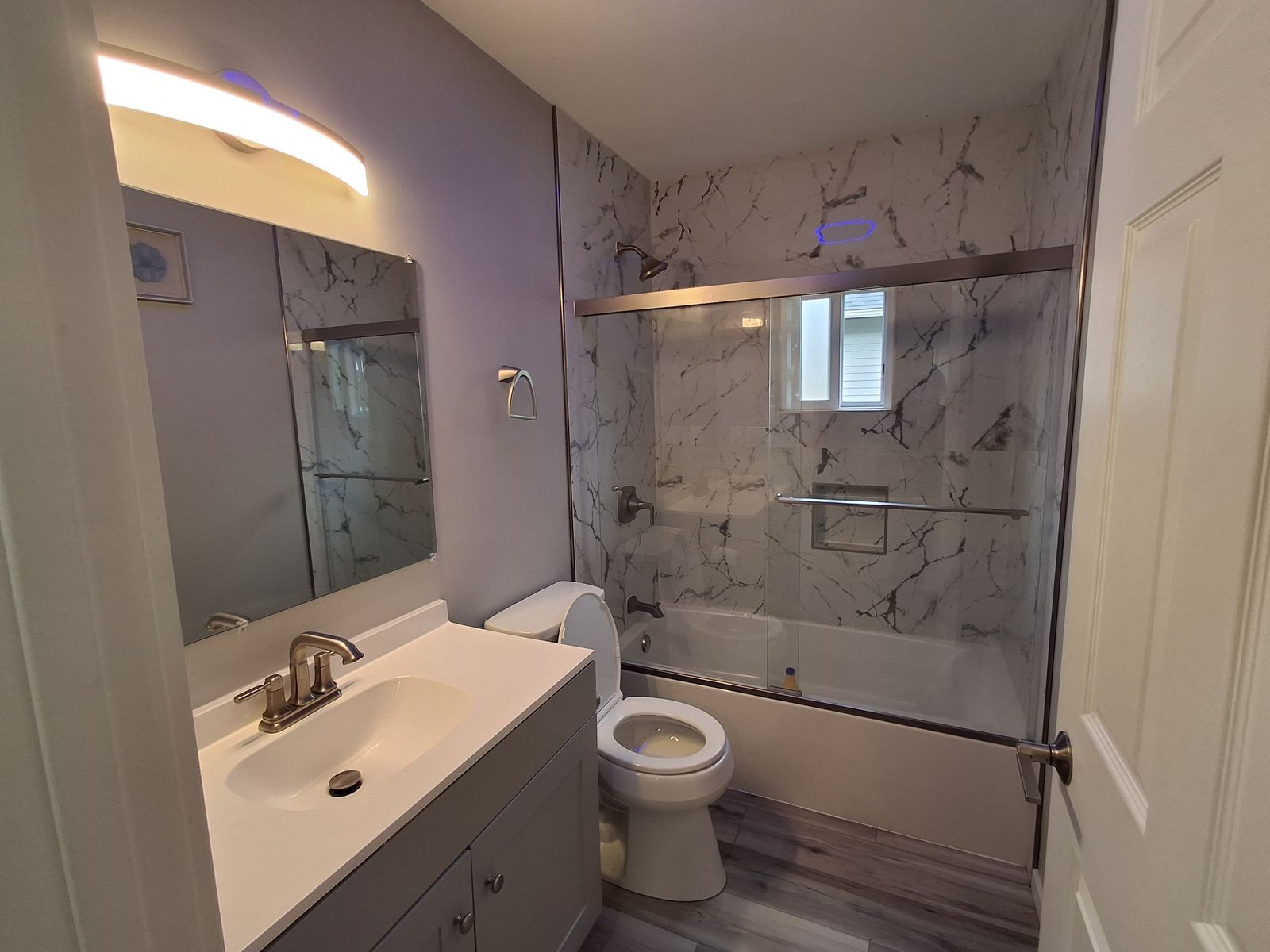 JCR Construction — bathroom remodel with marble surround, Everett WA